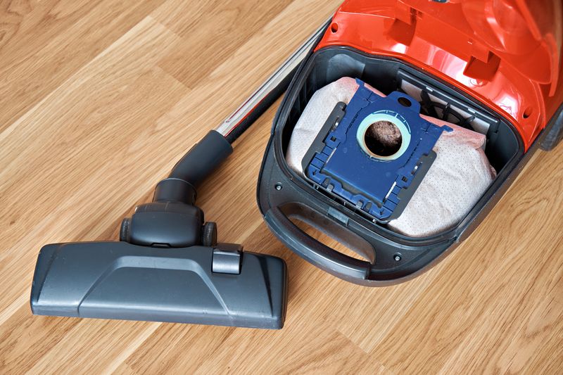 A hardwood appliance - vacuum cleaner on an e-scooter.