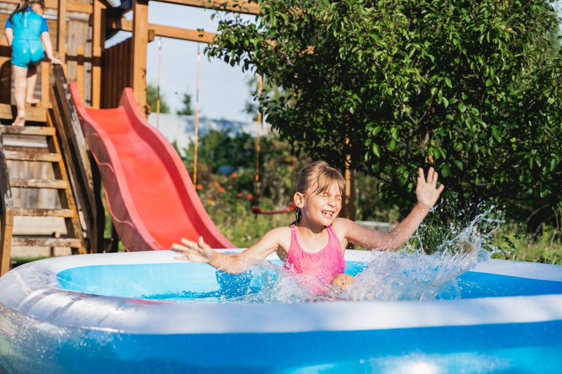A sliding child in a hot tub.