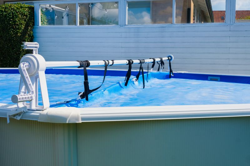 A hot tub in a pool with a lamp.