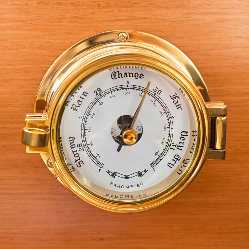 A wristwatch, gauge, and compass.