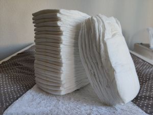 A stack of cushions, pillows, and linens.