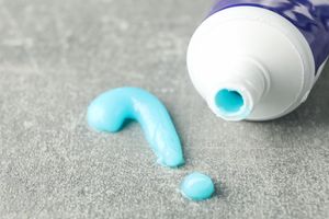 A turquoise toothpaste tube.
