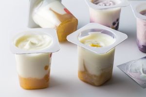 A dessert with yogurt, milk, cream, and ice cream.