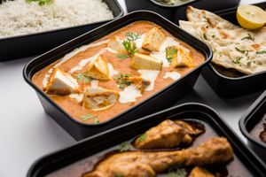 A plate of curry food presentation for a meal.