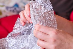 A person's hand with fingers made of aluminum.
