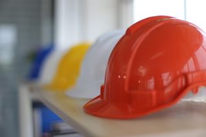 An image displaying clothing, hardhat, and helmet.