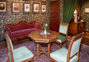 An image of a living room with a dining table.
