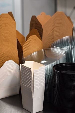 An image of an indoor room with boxes and art.
