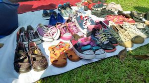 An image of clothing, footwear, and accessories including handbags.